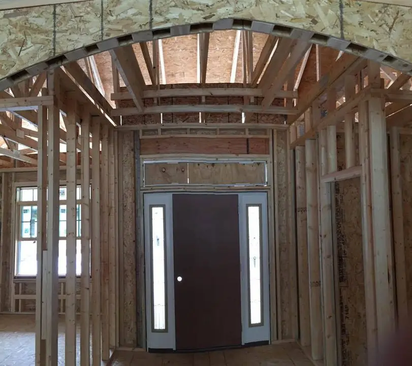 Arched front entry framed, by G&A Construction