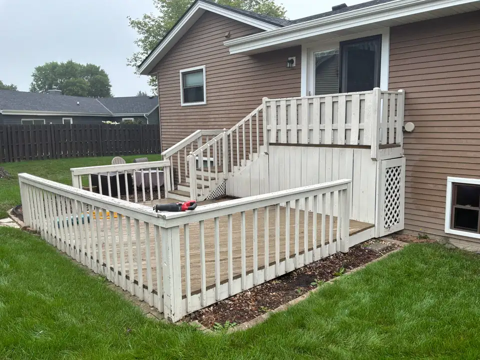 Before: A worn, painted deck and stairs that had reached the end of their life.