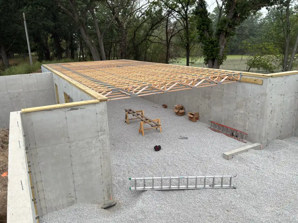 Floor trusses installed on a new home foundation